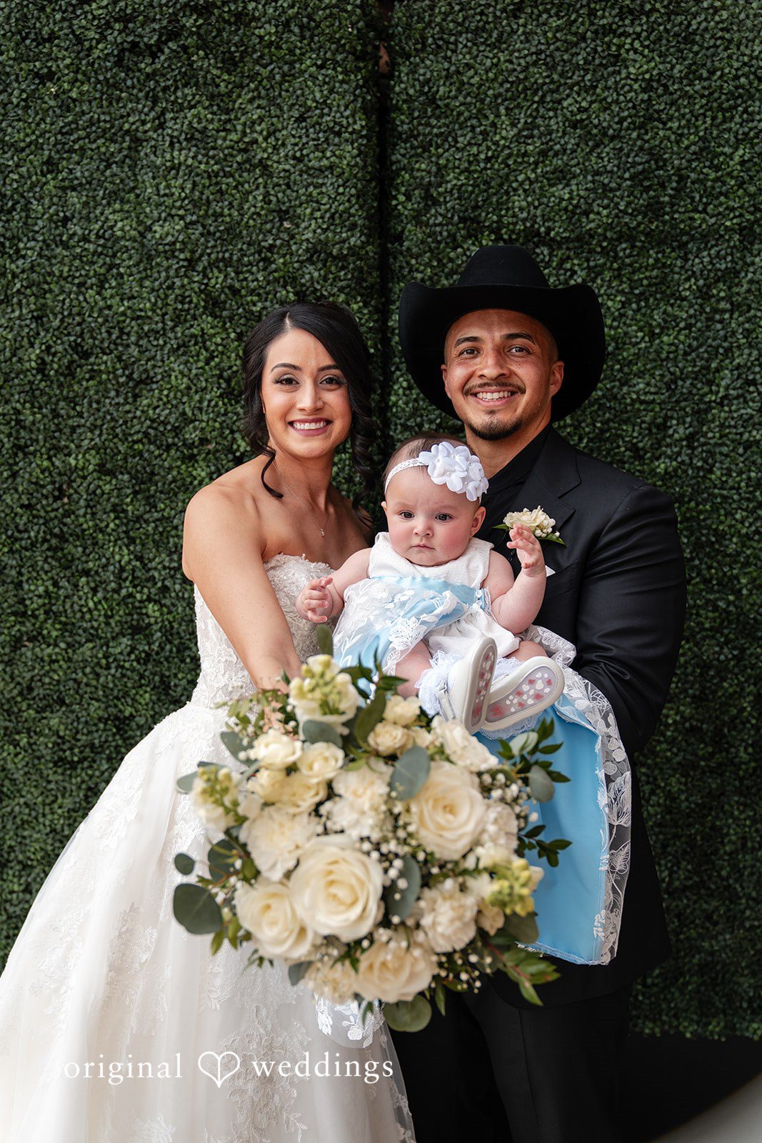 Emily + Miguel A portrait of the couple with their baby