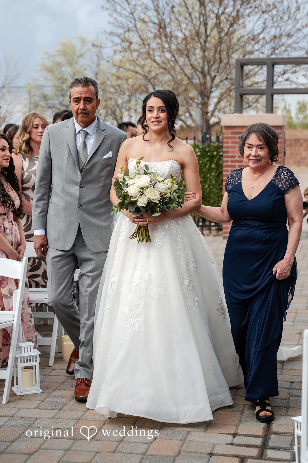 Emily + Miguel The bride's parents escort the bride down the aisle