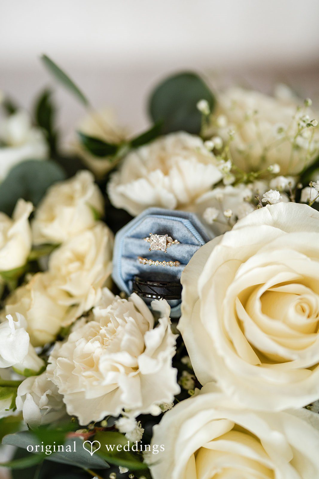 Emily + Miguel Wedding rings in bouquet