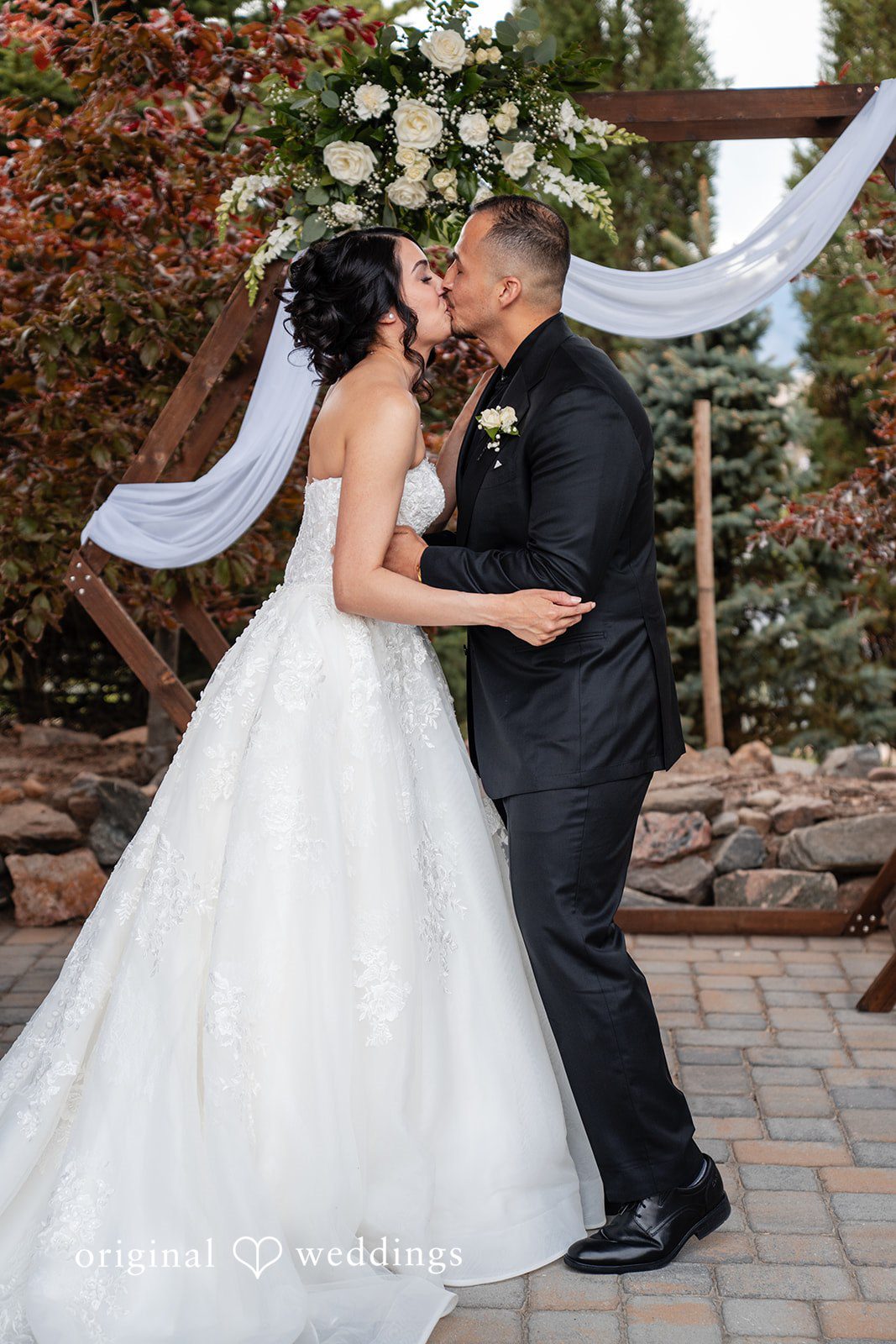 Emily + Miguel The couple takes a romantic kiss