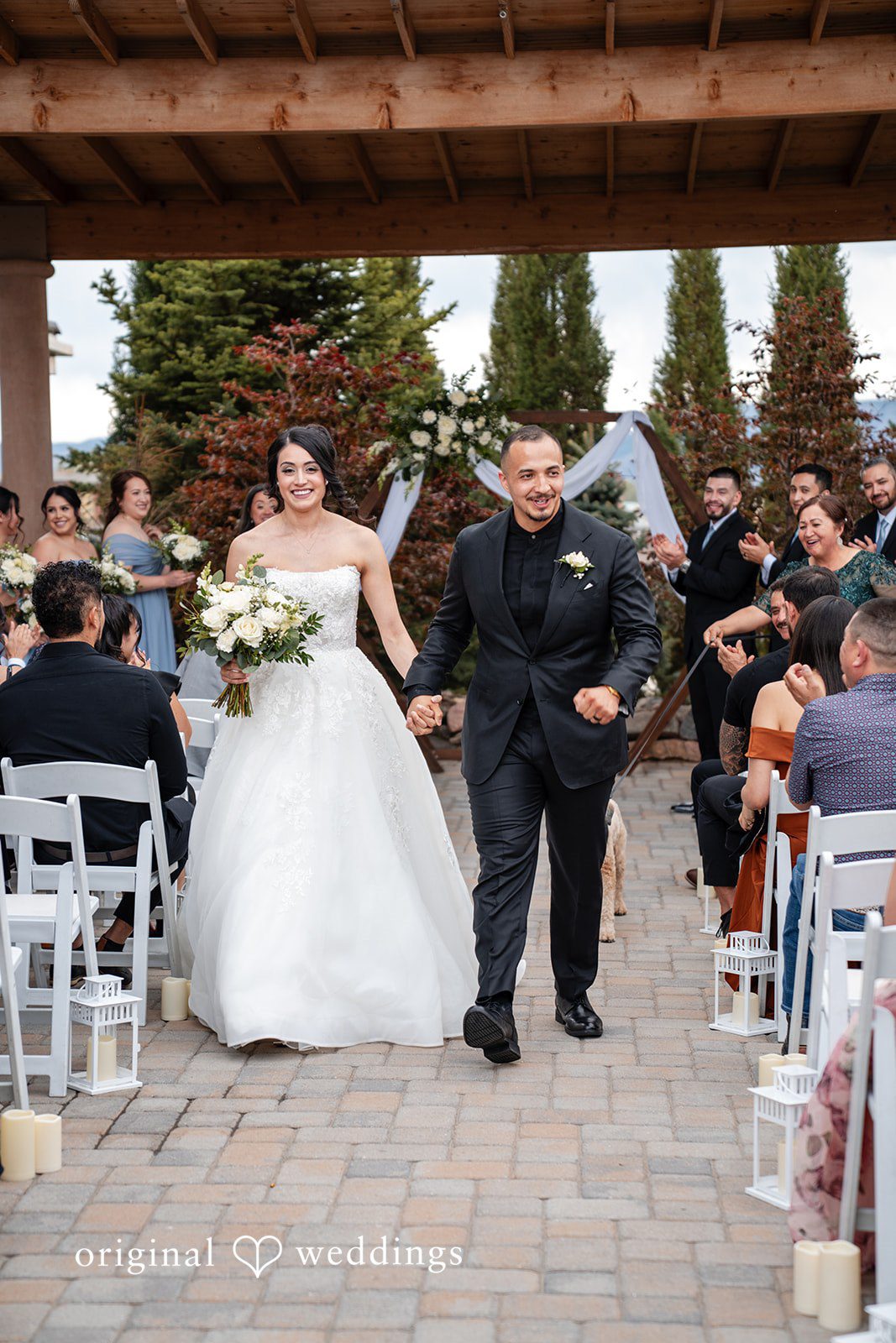 Emily + Miguel The couple makes a joyful exit after the vows exchange