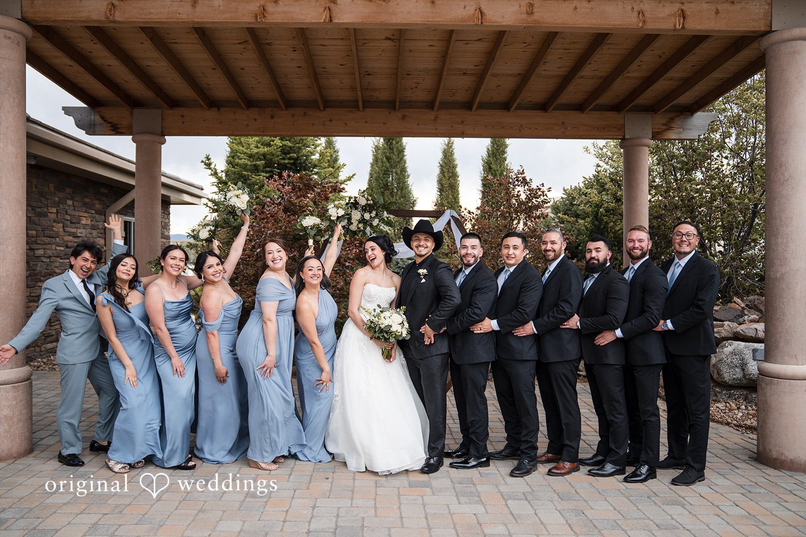 Our Denver wedding photographers at Original Weddings captured a stunning portrait of the couple and their bridal party at Ashley Ridge