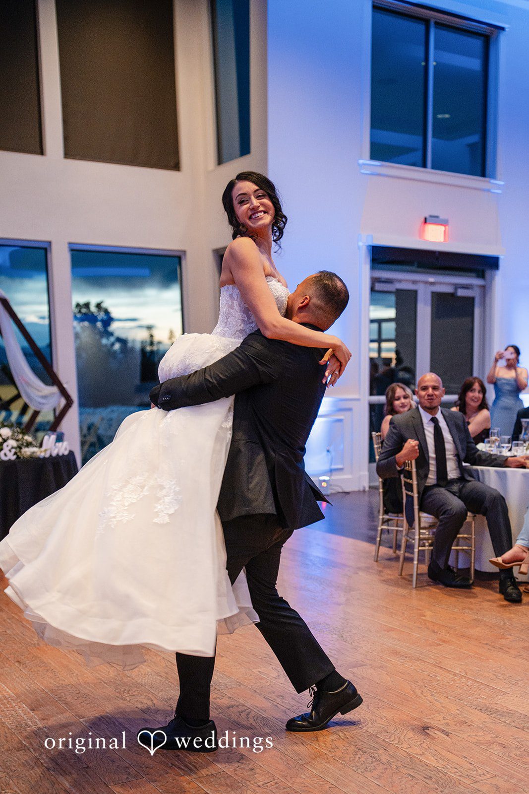 Emily + Miguel The groom lifts the bride up