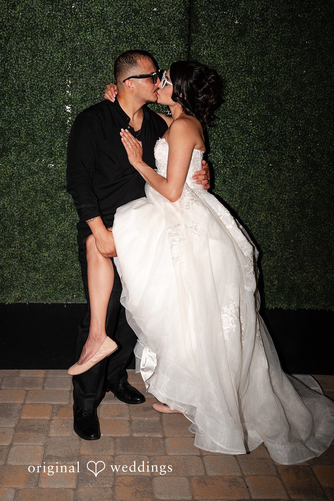 Emily + Miguel The couple shares a kiss