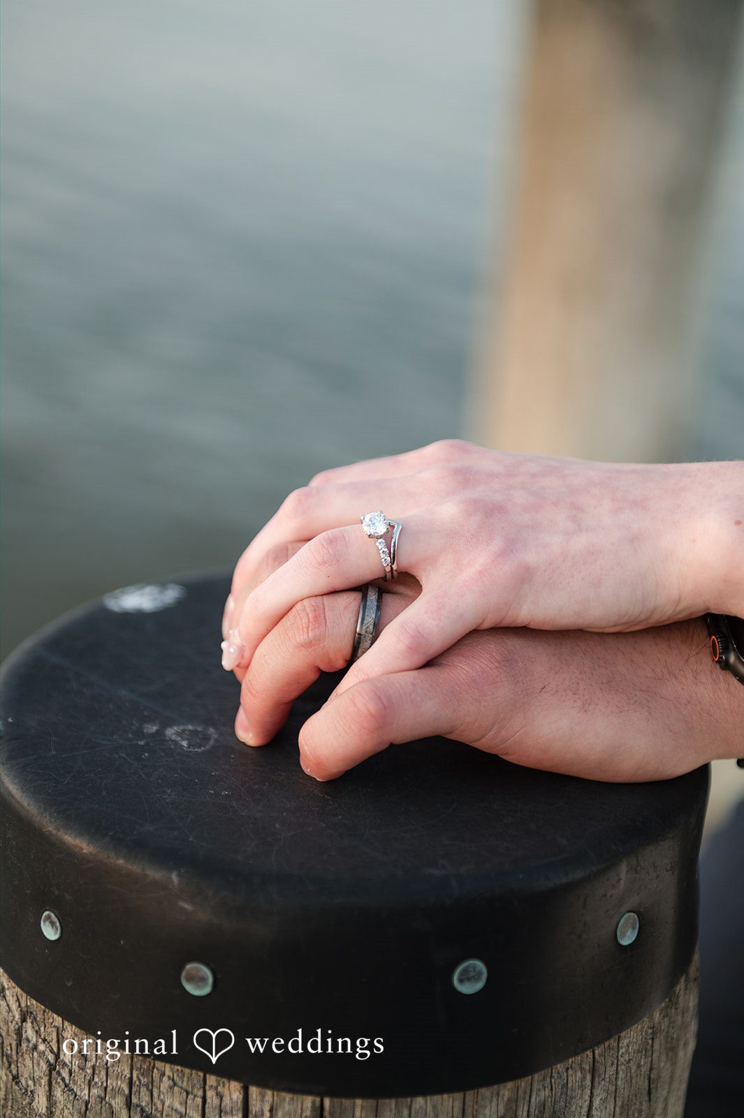 Andrew + Paige Couple showing their wedding rings during a portrait session
