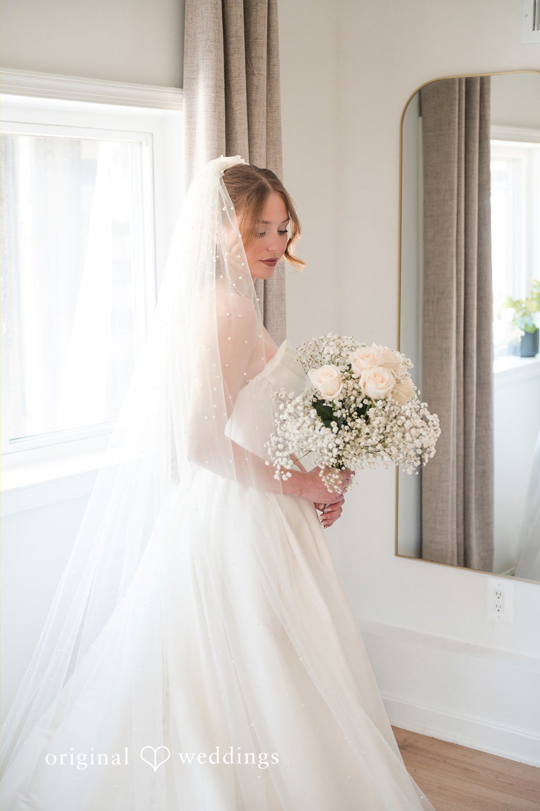 Andrew + Paige Bride holding her bouquet during a bridal portrait
