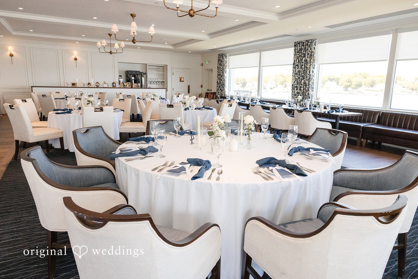 Andrew + Paige Wide view of reception tables prepared for the wedding celebration