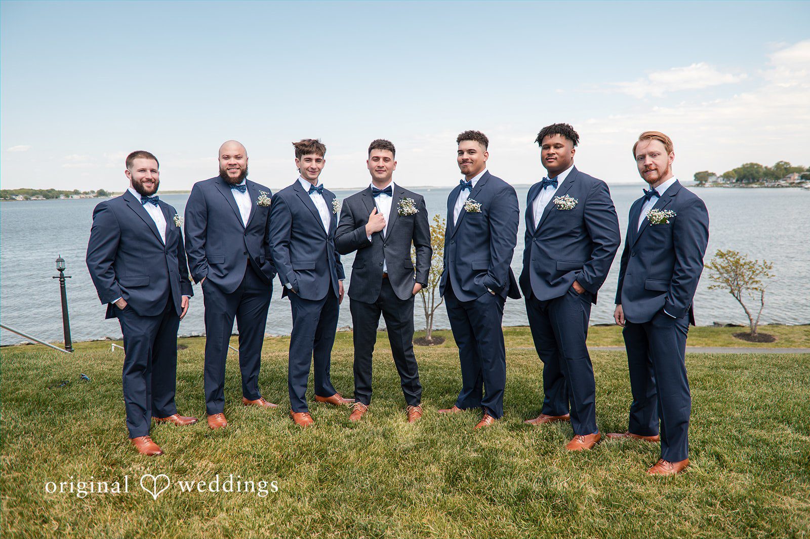 Andrew + Paige Groom posing with his groomsmen before the ceremony