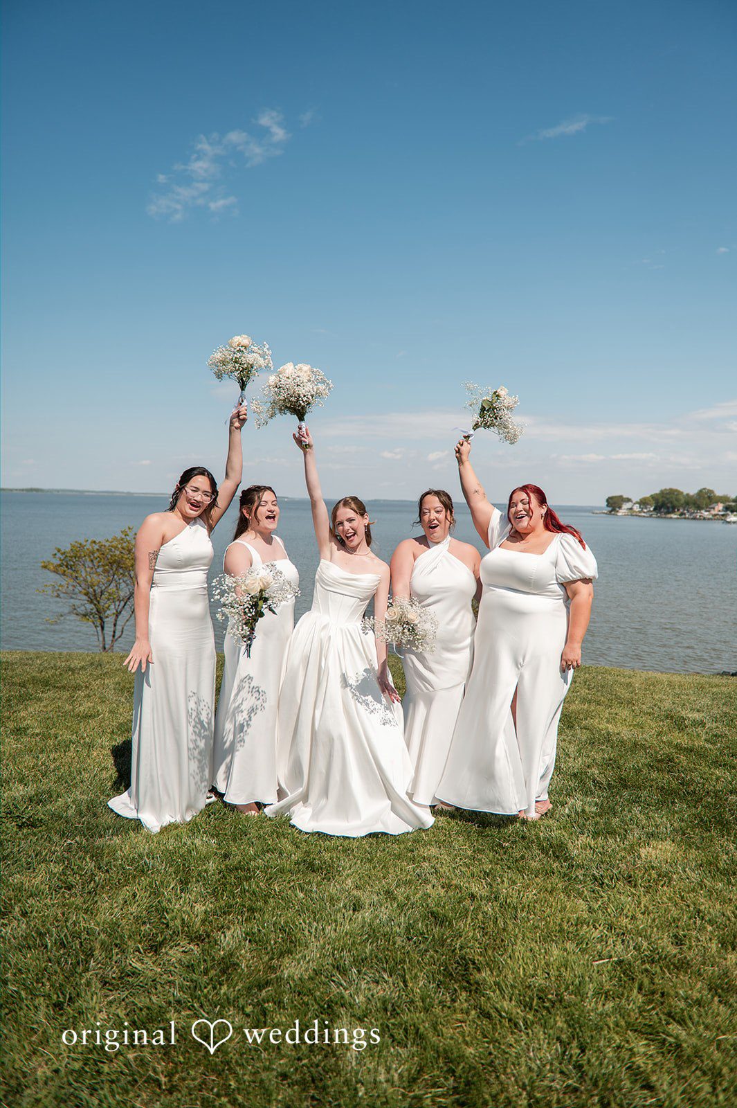 Andrew + Paige Bride posing with her bridesmaids before the ceremony
