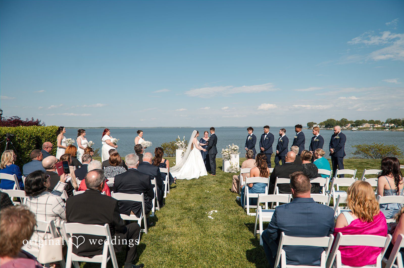 Andrew + Paige Wide view of the ceremony with guests in attendance
