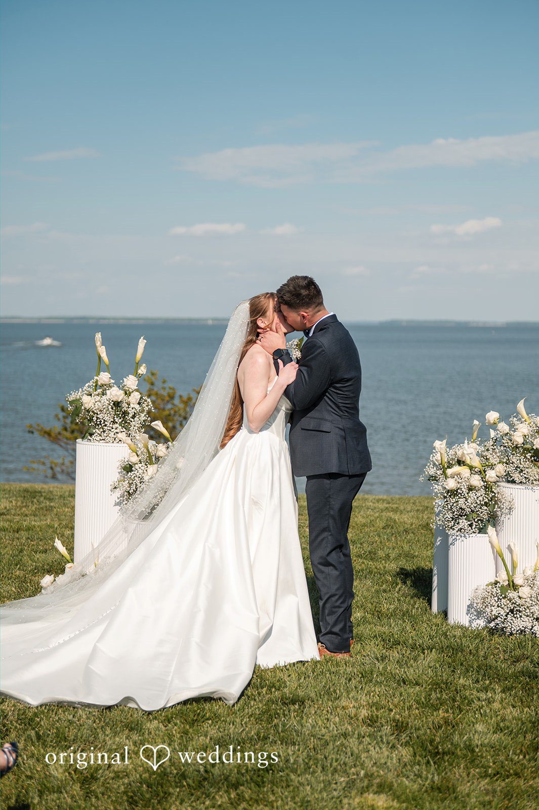 Andrew + Paige Groom kissing the bride after exchanging vows
