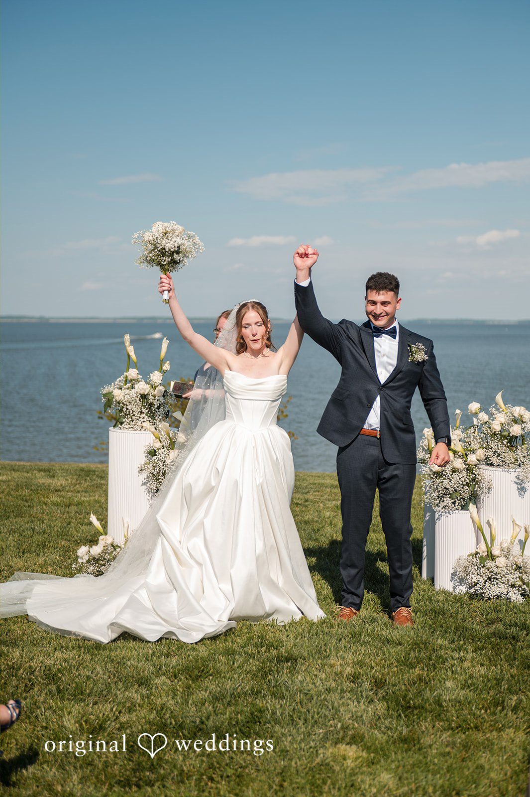 Andrew + Paige Newlyweds walking hand in hand after the ceremony