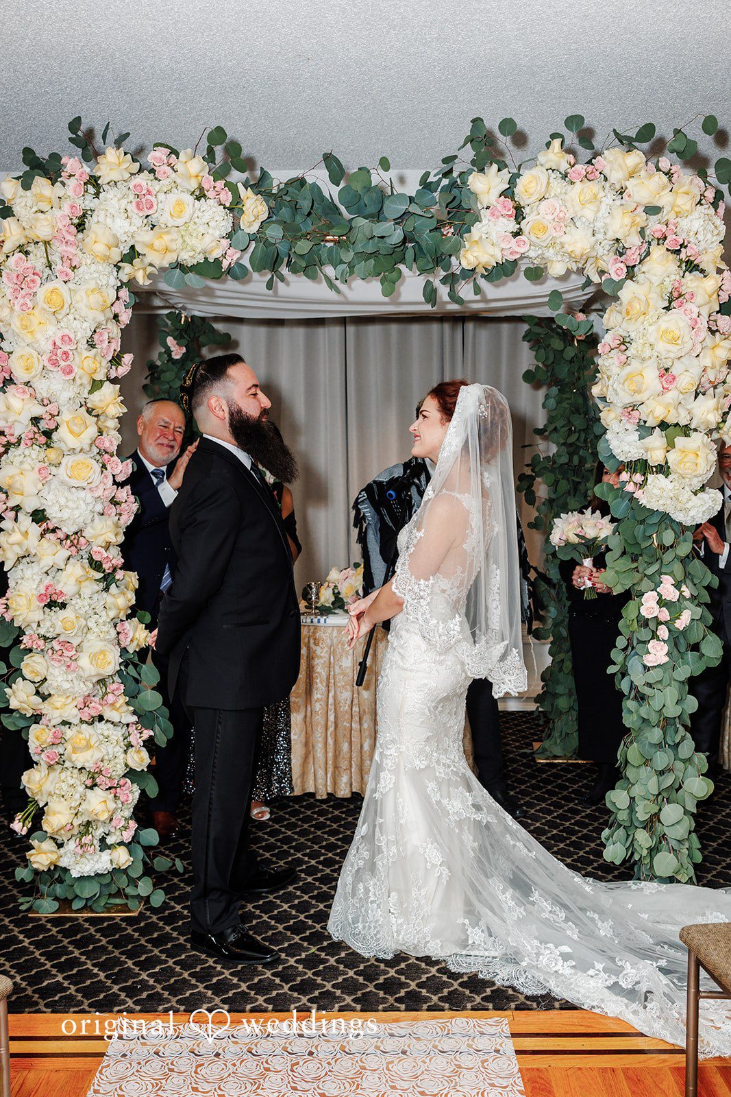 Beautiful ceremony interaction photography of couple  at Bay Ridge Manor