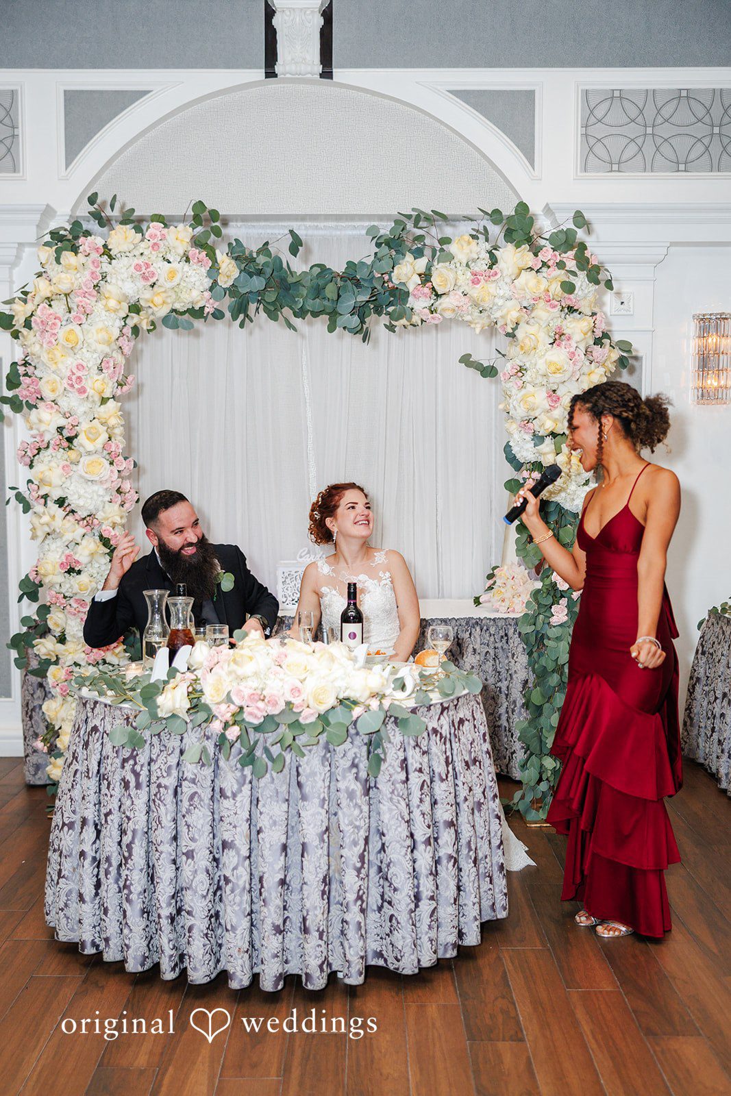 Couple seated together at reception table at Bay Ridge Manor