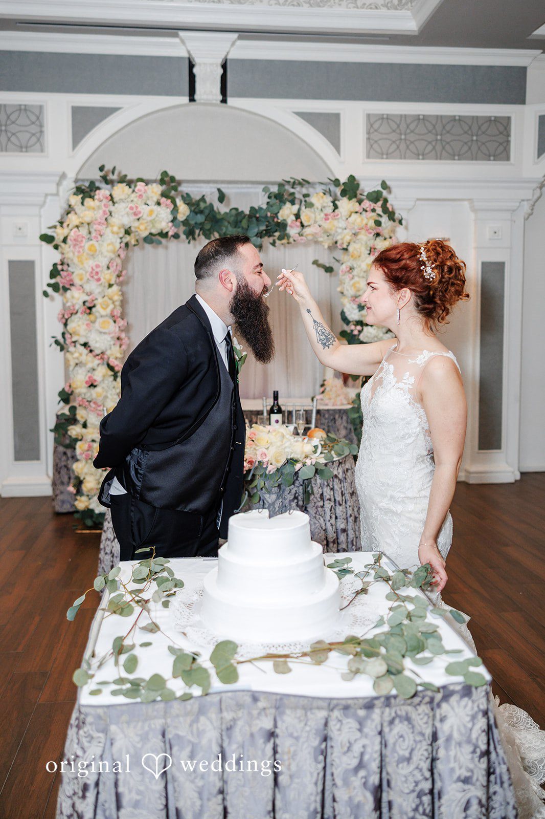 Romantic cake sharing moment at Bay Ridge Manor