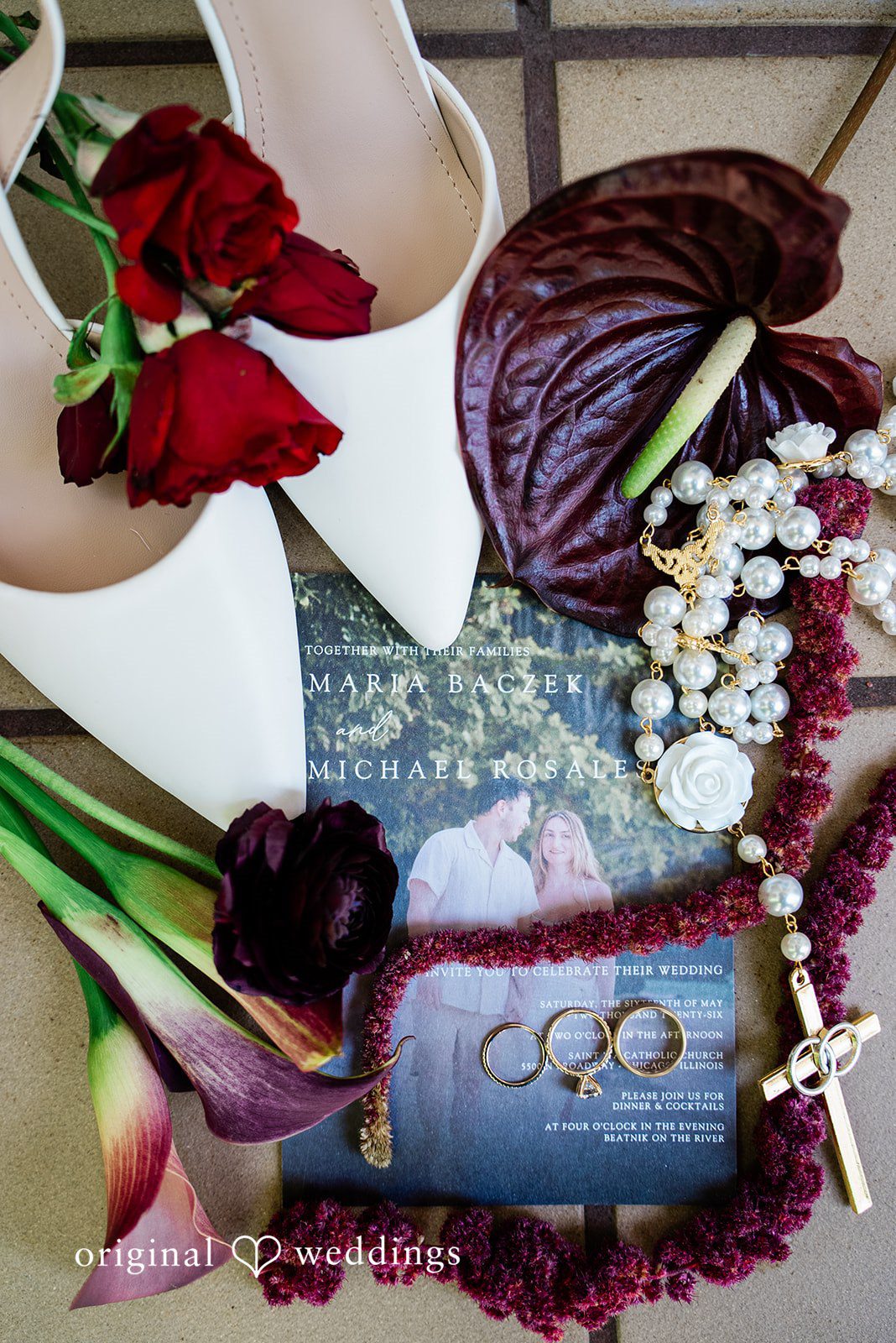 Michael + Maria A styled flat lay featuring wedding shoes, florals, jewelry, rings, and invitation details