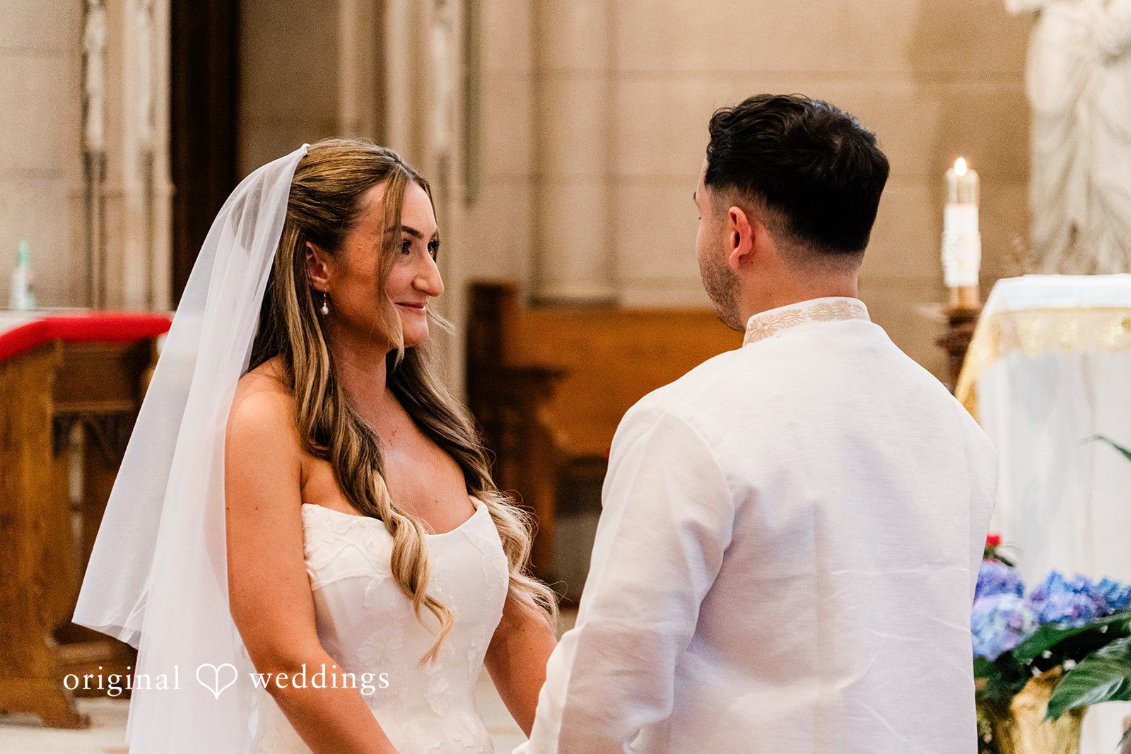 Michael + Maria Bride and groom sharing a heartfelt moment during their church wedding ceremony.
