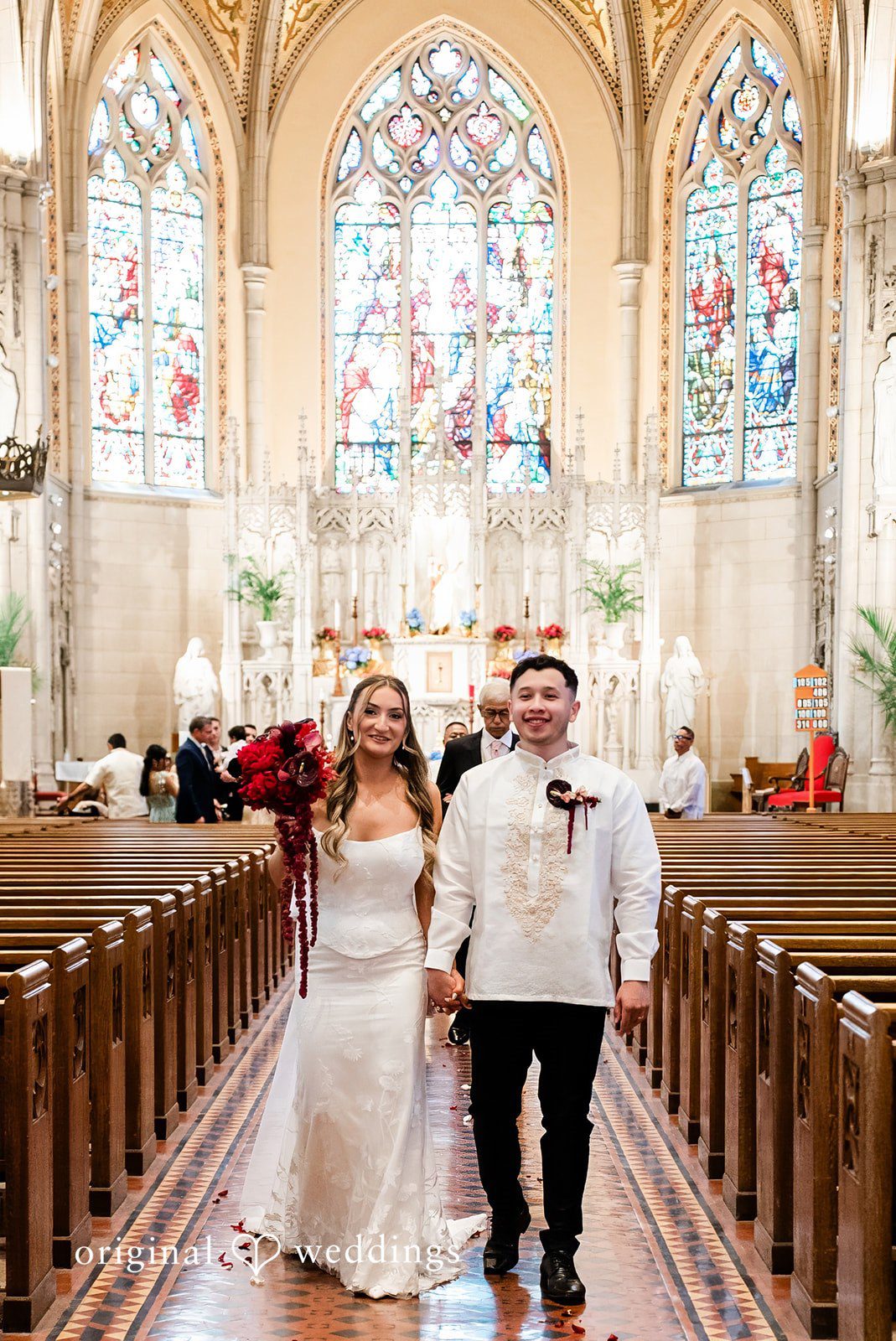 Michael + Maria Bride and groom walking down the church aisle after their wedding ceremony.