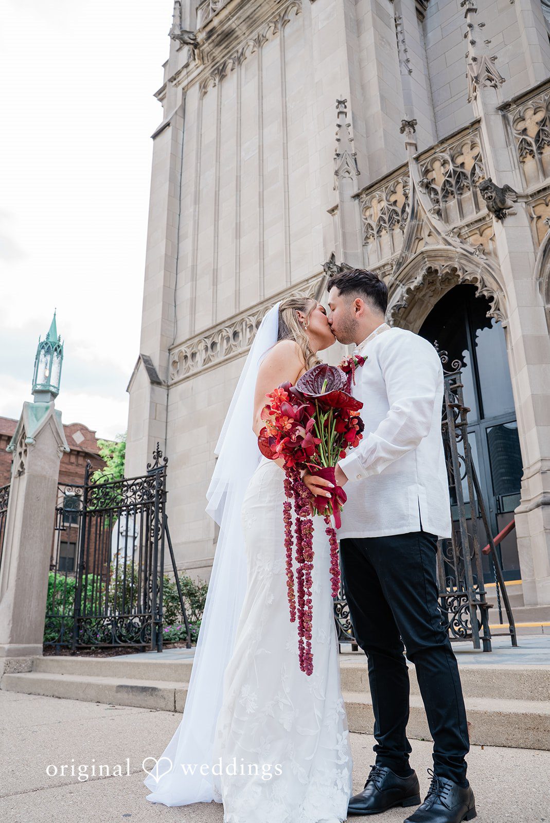 Michael + Maria Bride and groom sharing a kiss at Beatnik On The River