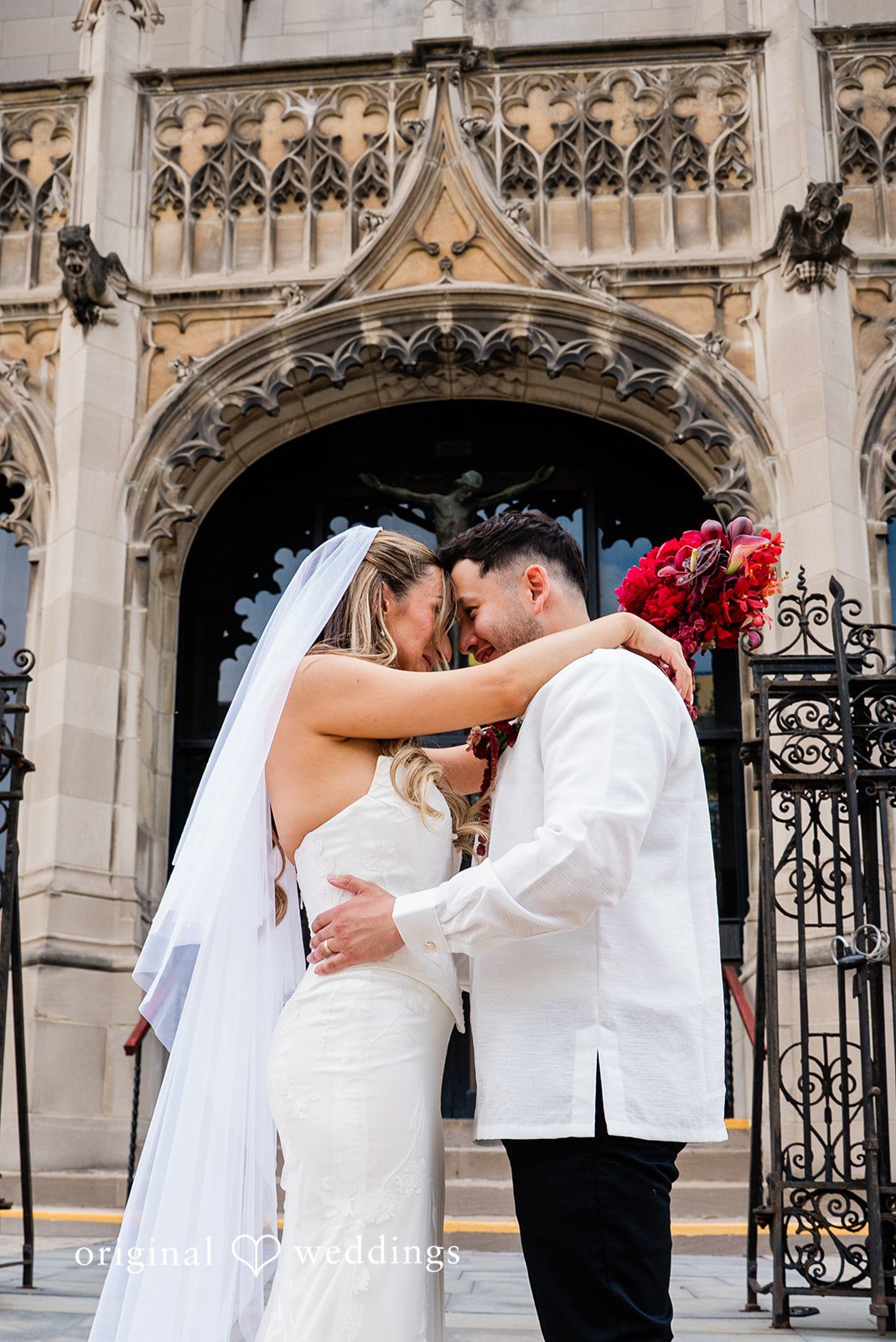 Michael + Maria Bride and groom sharing an intimate embrace at Beatnik on the River captured by Chicago wedding photographers from Original Weddings