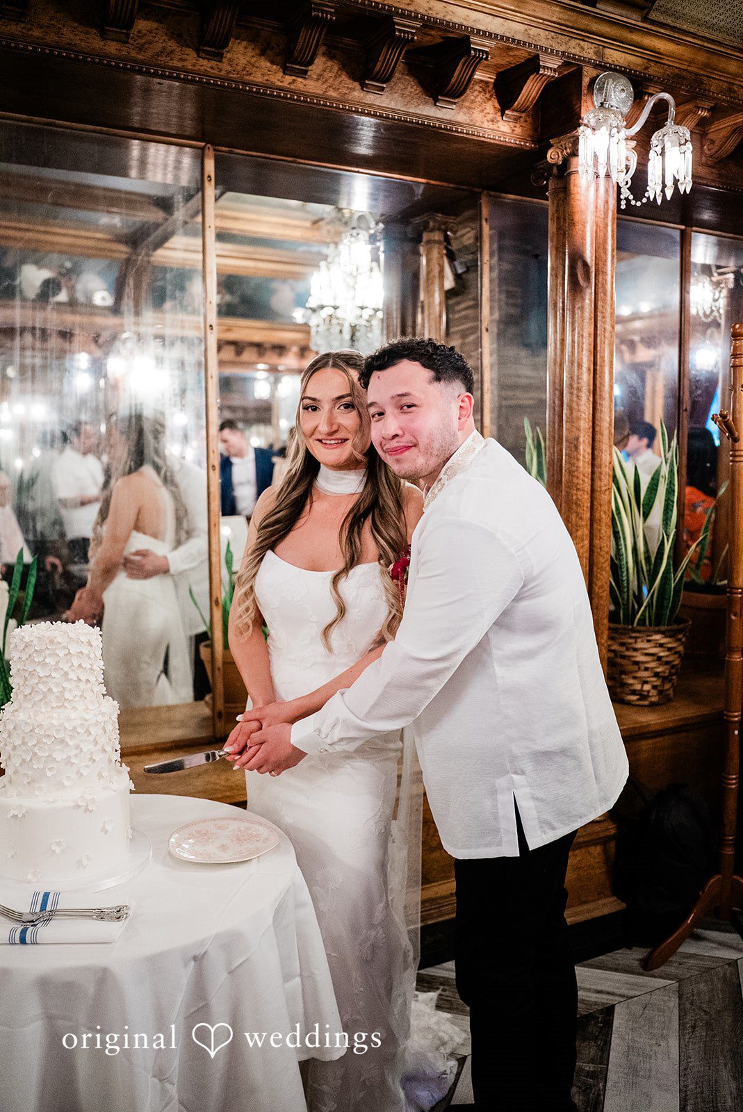 Michael + Maria Bride and groom cutting their wedding cake at Beatnik on the River during the reception.