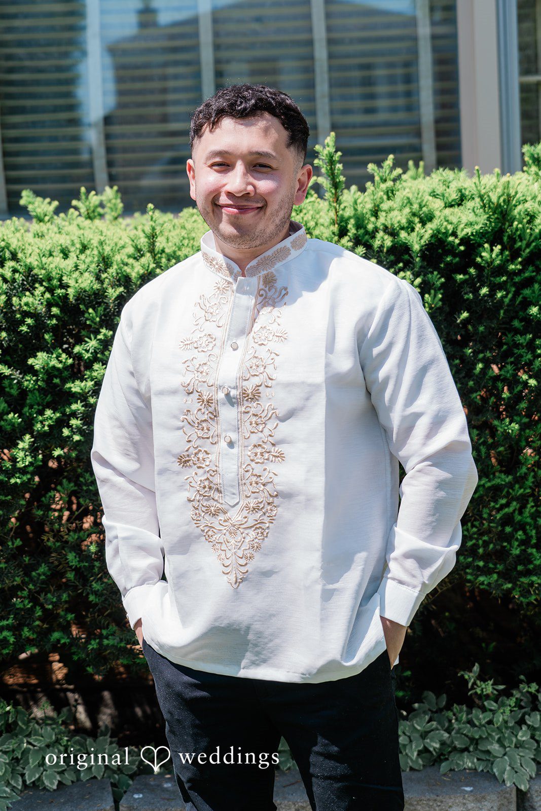 Michael + Maria Groom portrait in traditional embroidered attire during wedding preparations outdoors.