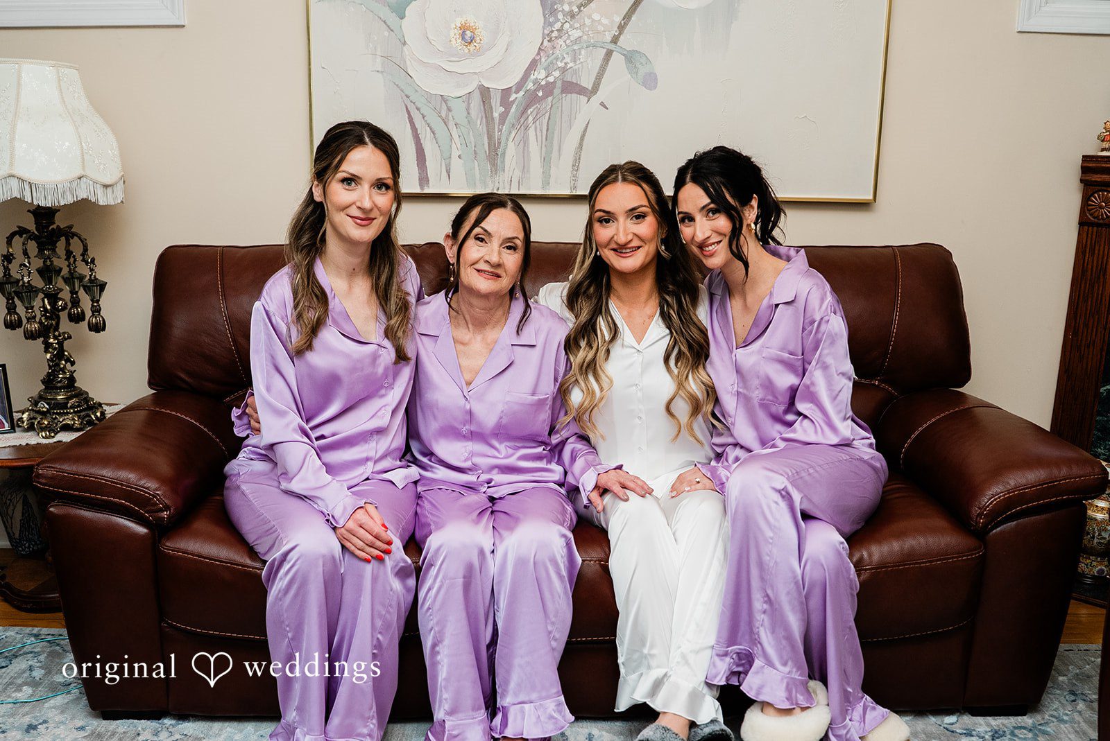 Michael + Maria Bride with bridesmaids in matching satin pajamas during wedding preparations.