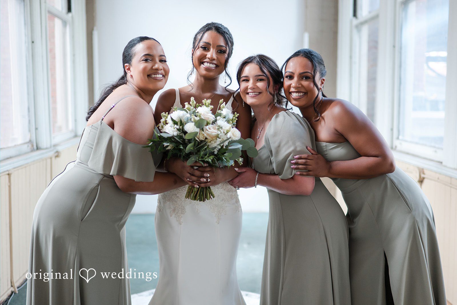 Sydney + Ty Bride posing with her bridesmaids before the ceremony