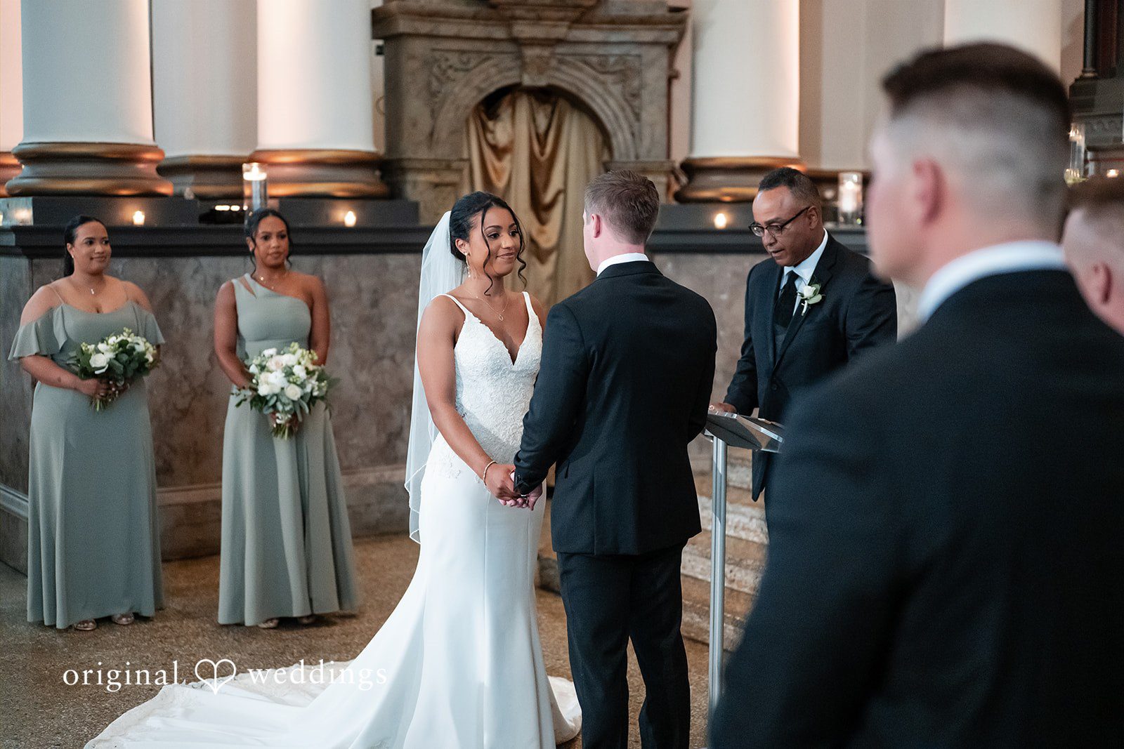 Sydney + Ty Bride and groom holding hands during the ceremony