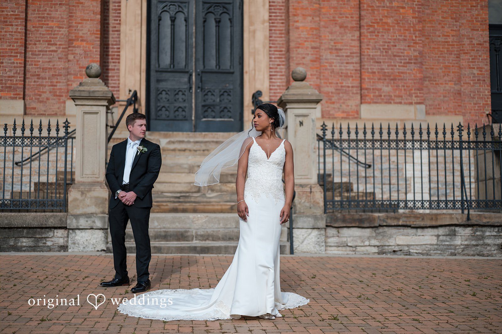Sydney + Ty Bride and groom standing together outdoors during portraits