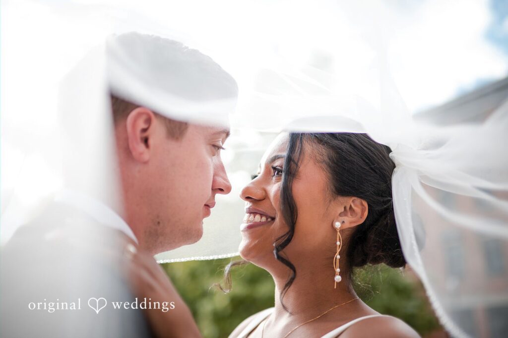 Sydney + Ty Bride and groom sharing a romantic look beneath the veil