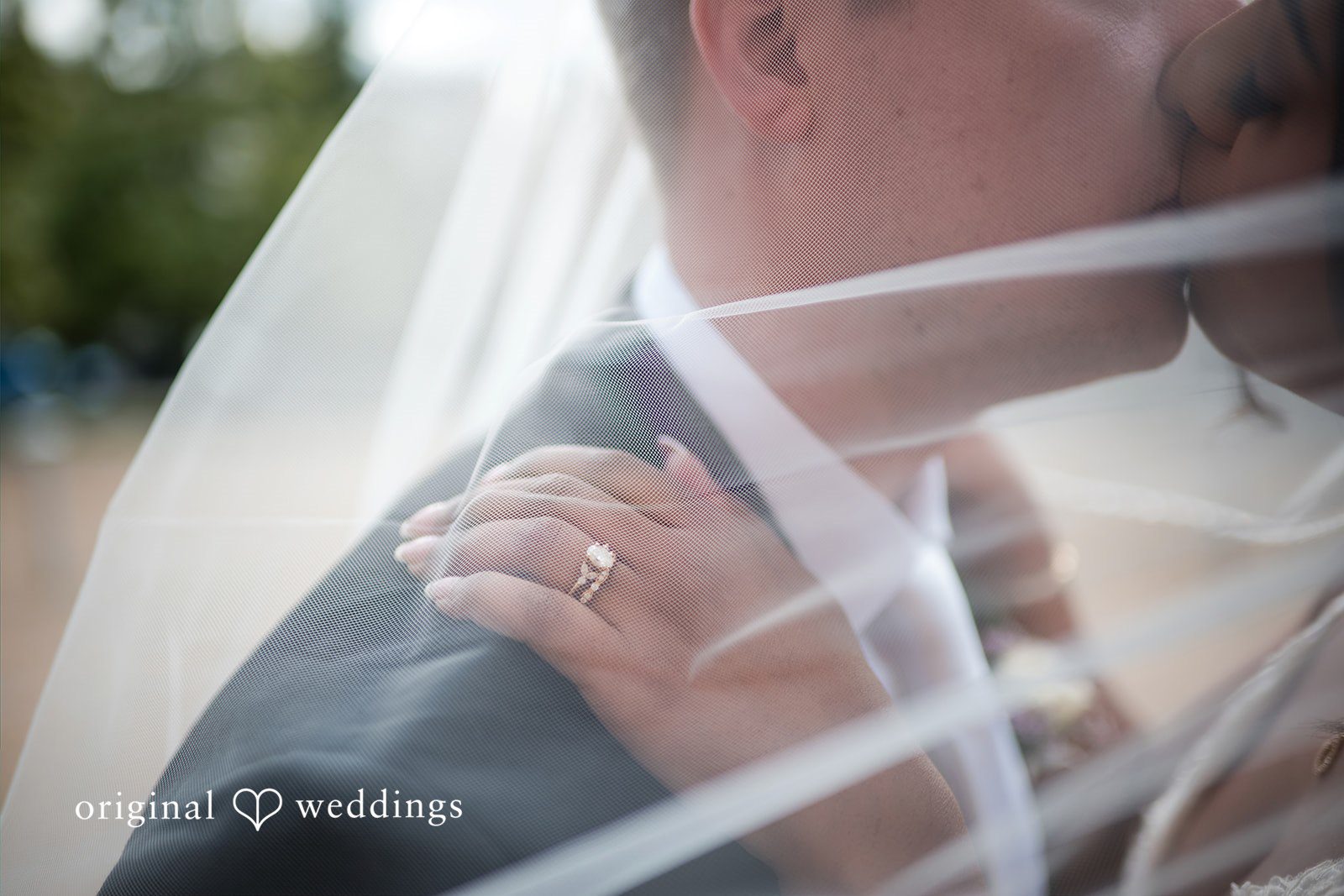 Sydney + Ty Bride and groom kissing beneath the wedding veil