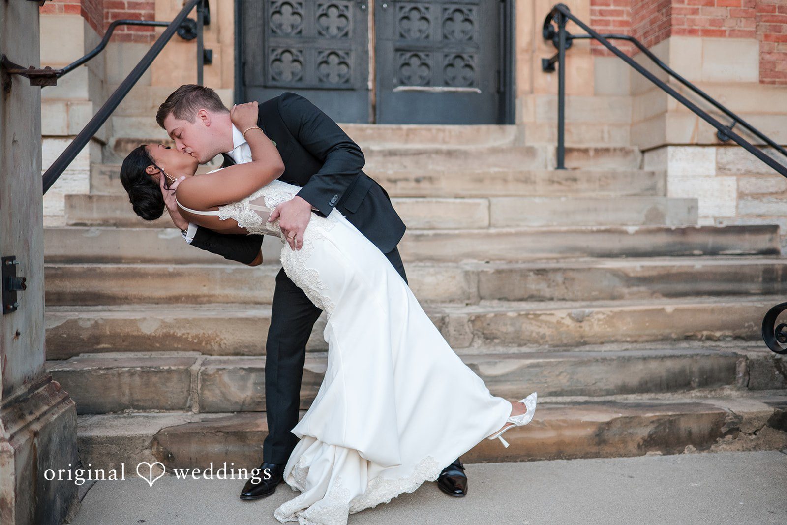 Sydney + Ty Groom kissing the bride during a romantic wedding portrait