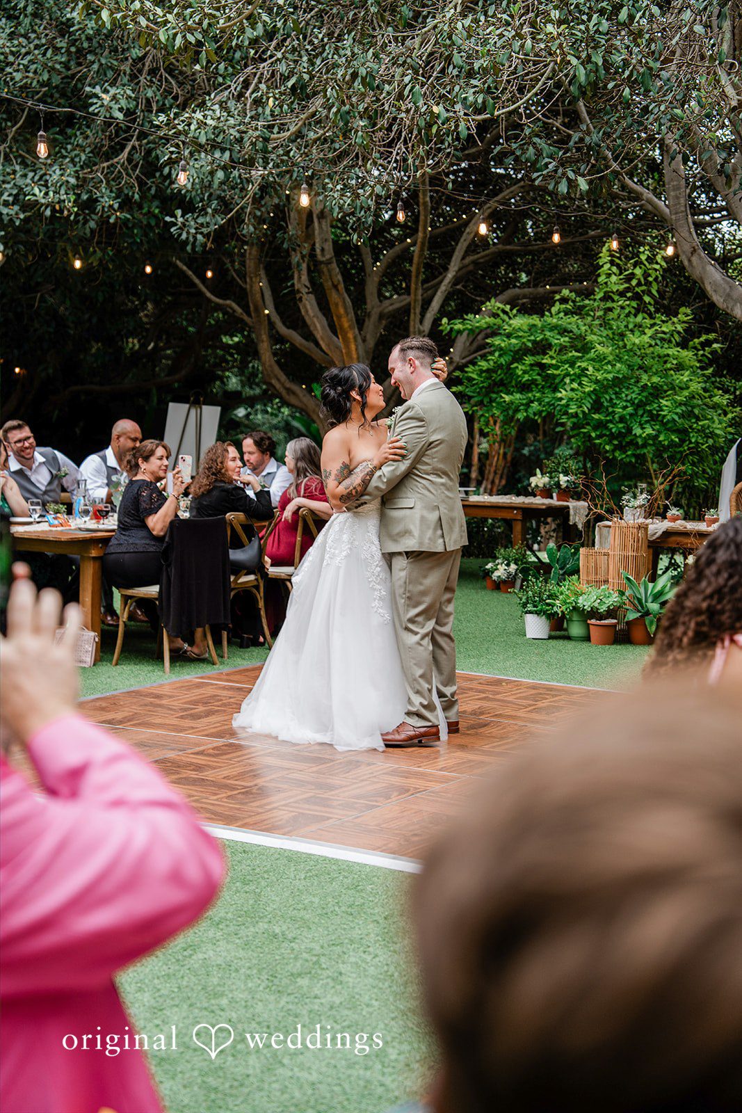 Mae + Nicholas The newlyweds share their first dance surrounded by loved ones
