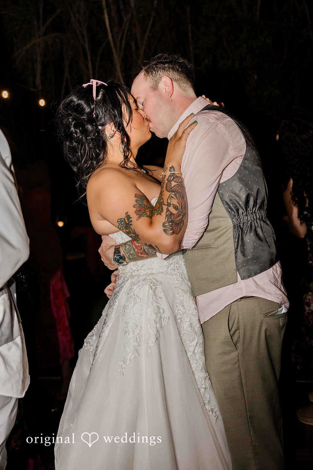 Mae + Nicholas The couple shares a romantic kiss during their lively evening celebration