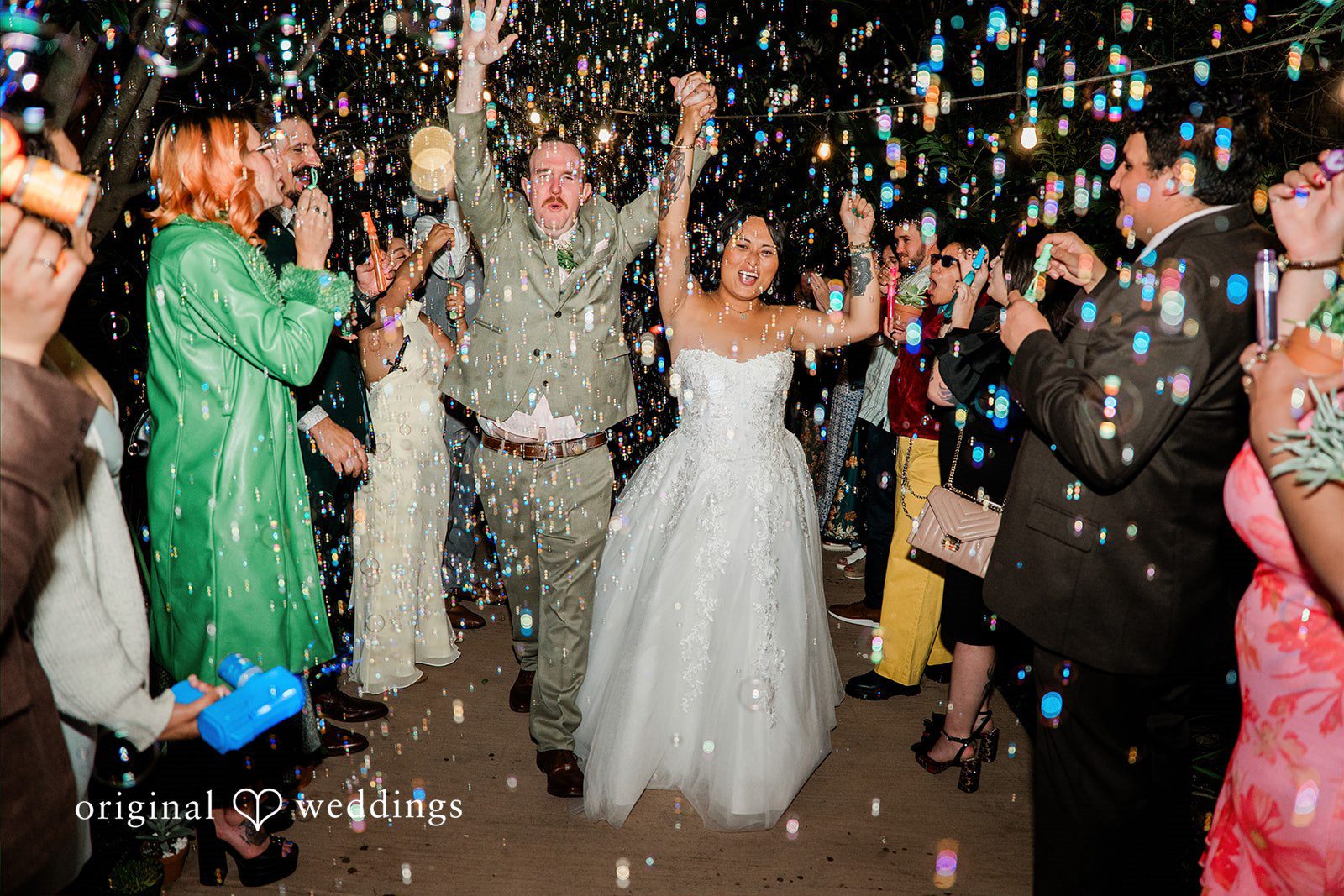 Mae + Nicholas Newlyweds make a joyful bubble-filled exit surrounded by cheering guests
