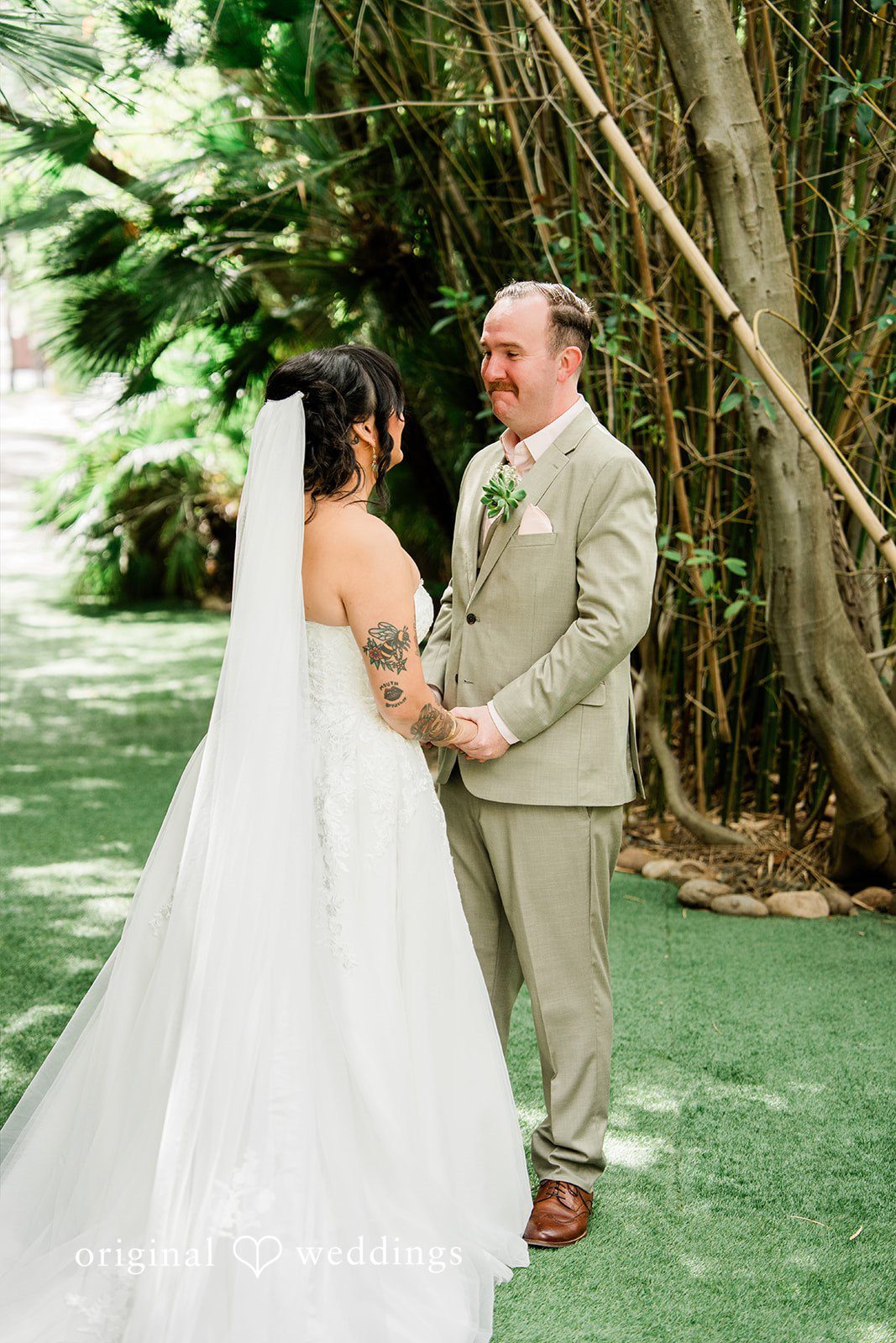 Mae + Nicholas Emotional first-look moment as the couple holds hands at Botanica