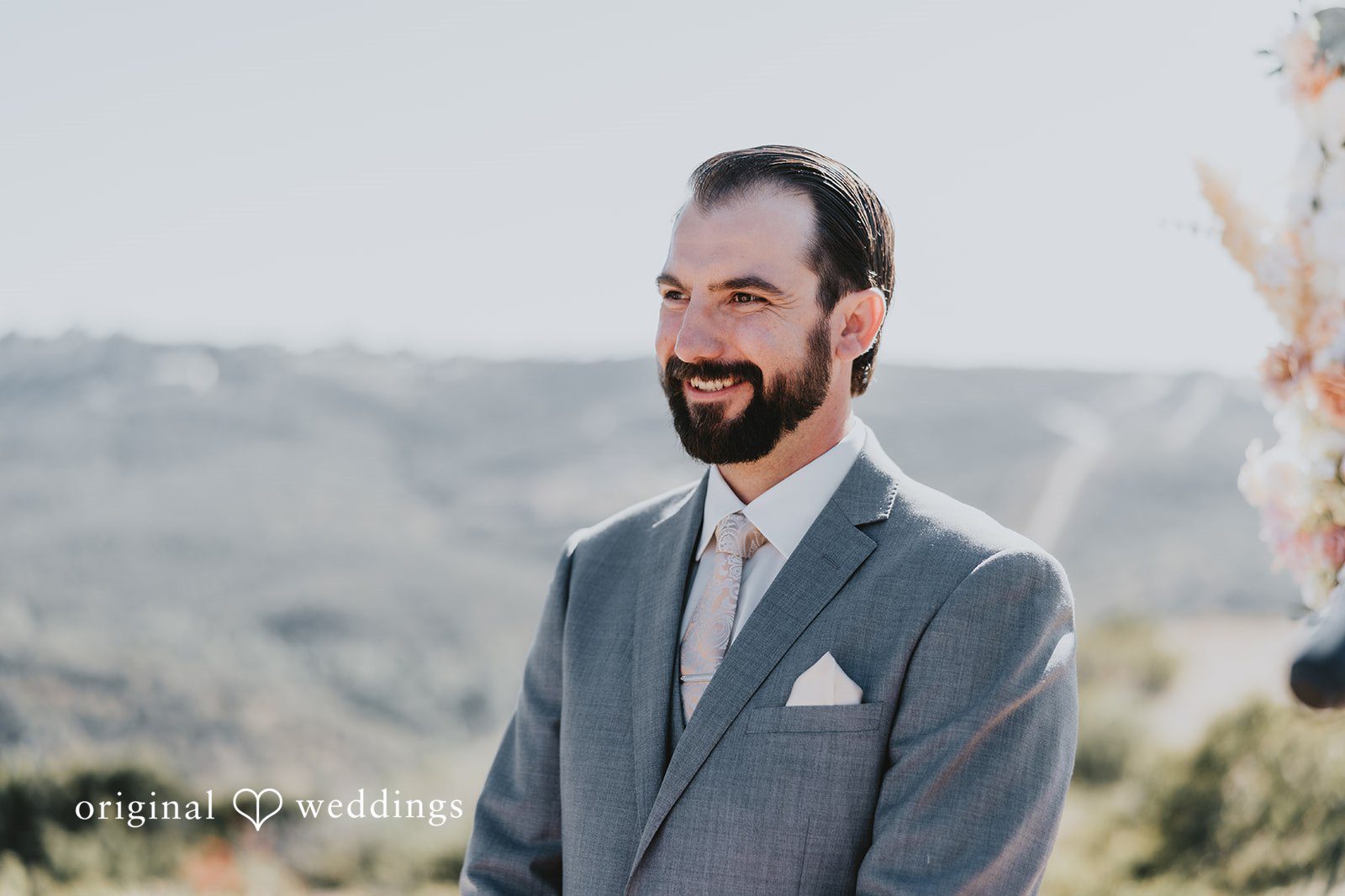 Groom looking for the bride with joy