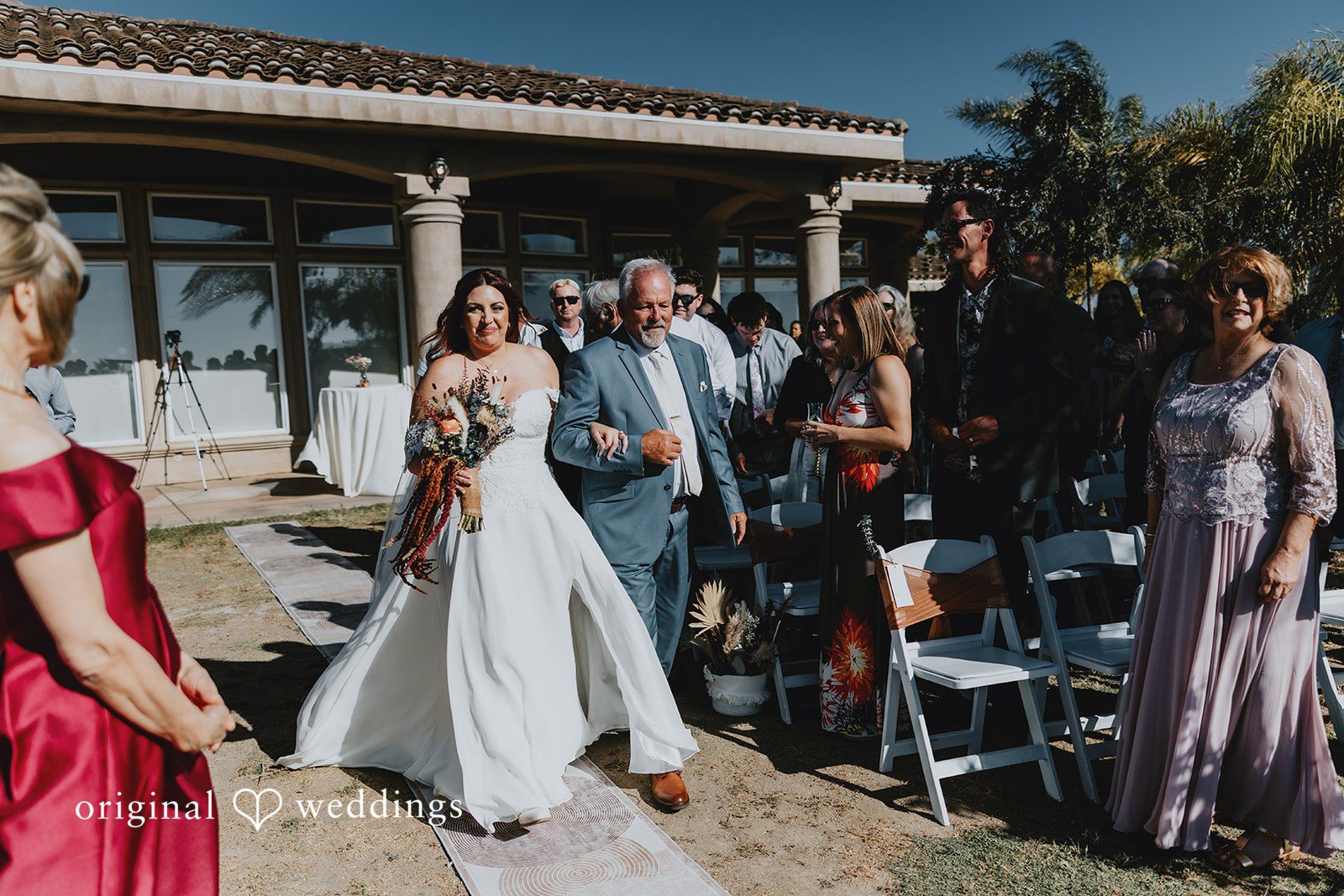 Bride walking down the aisle with someone