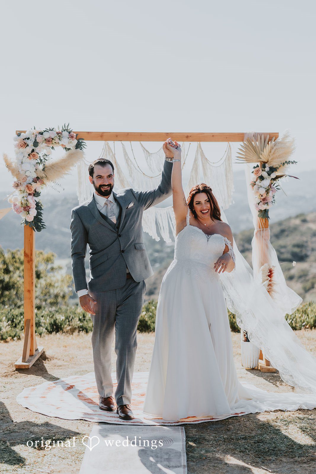 Couple cheering up and celebrating their wedding