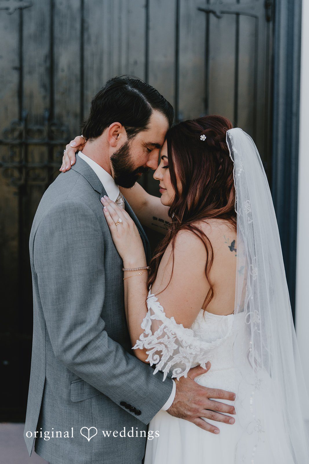 A candid hug moment of bride and groom