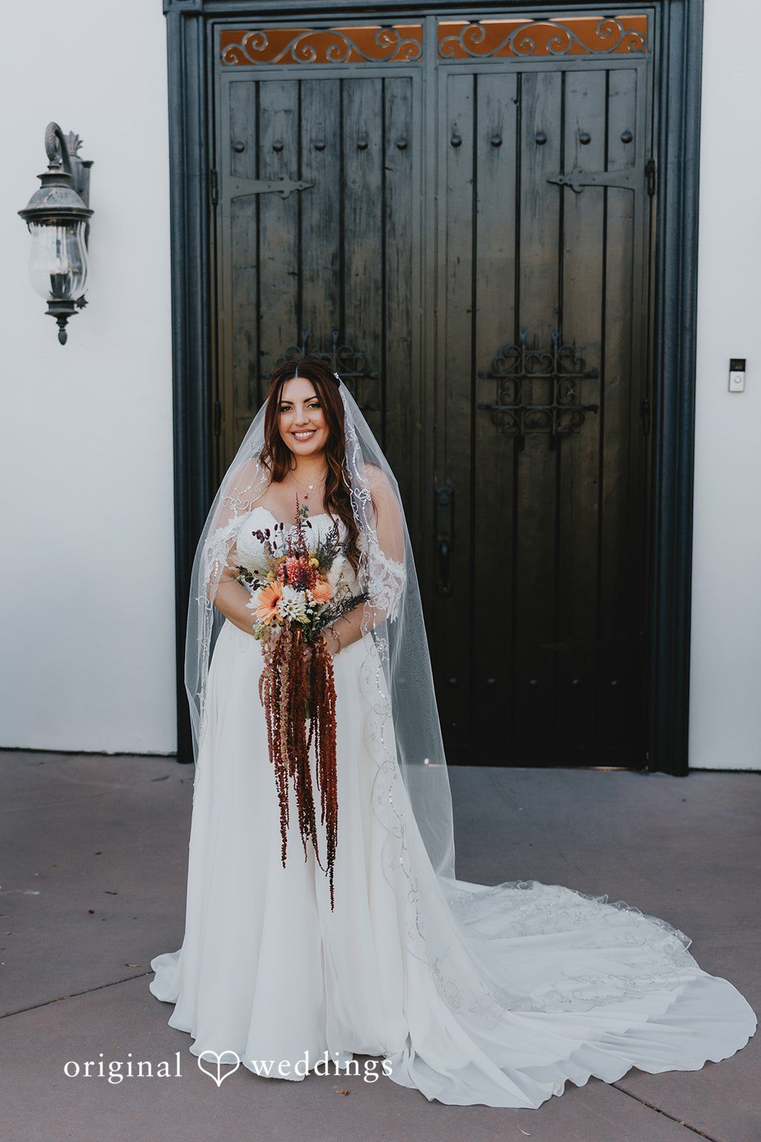 Bride posing for wedding photography while holding bouquet
