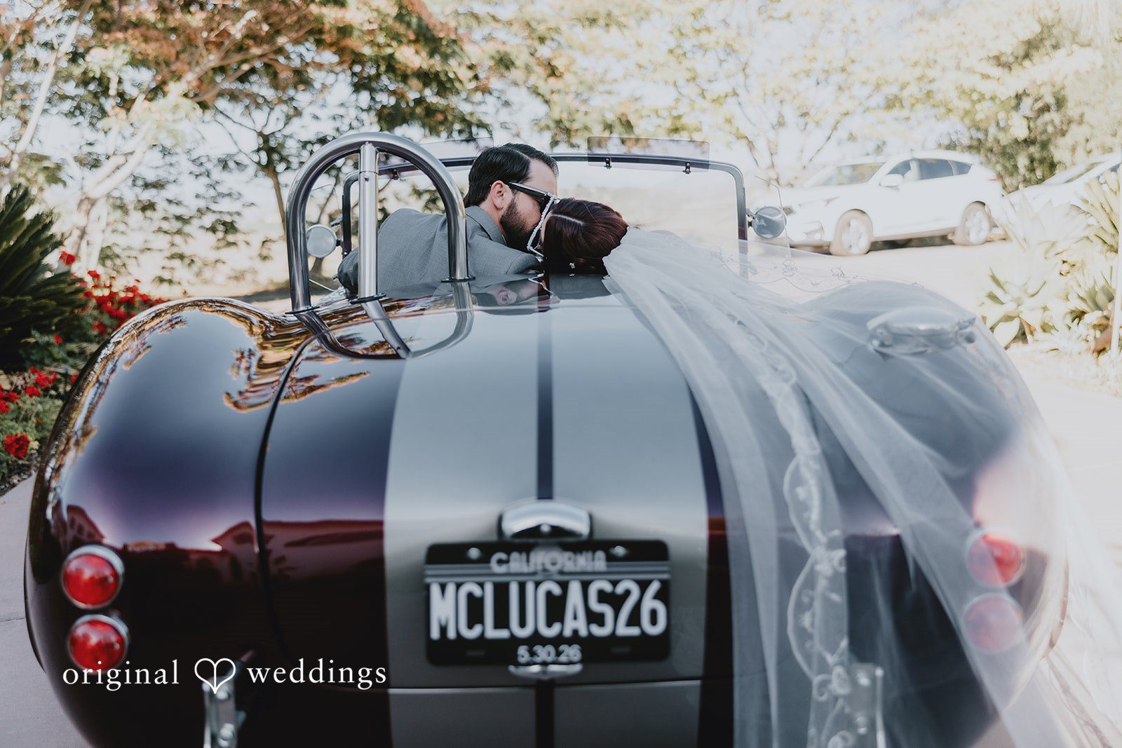 Couple sharing a kiss in a car