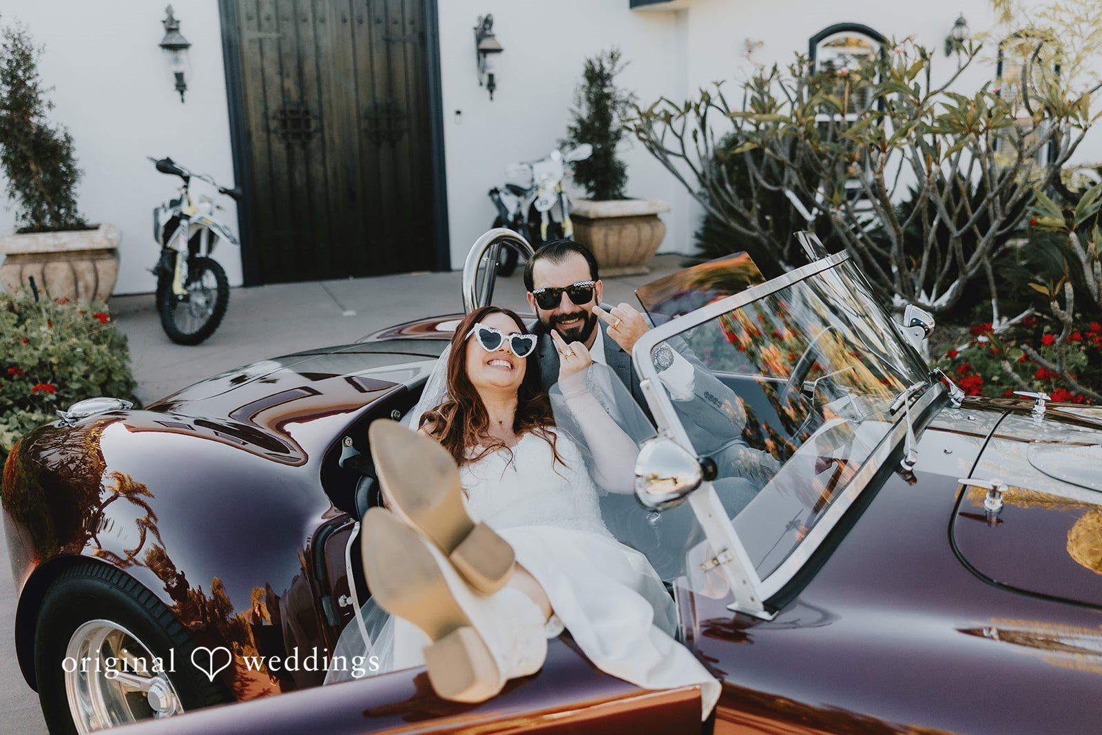 Lovely pose of bride and groom in a car