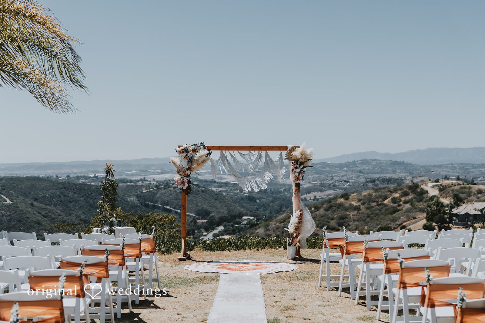 Scenic outdoor view of altar decorated for wedding ceremony