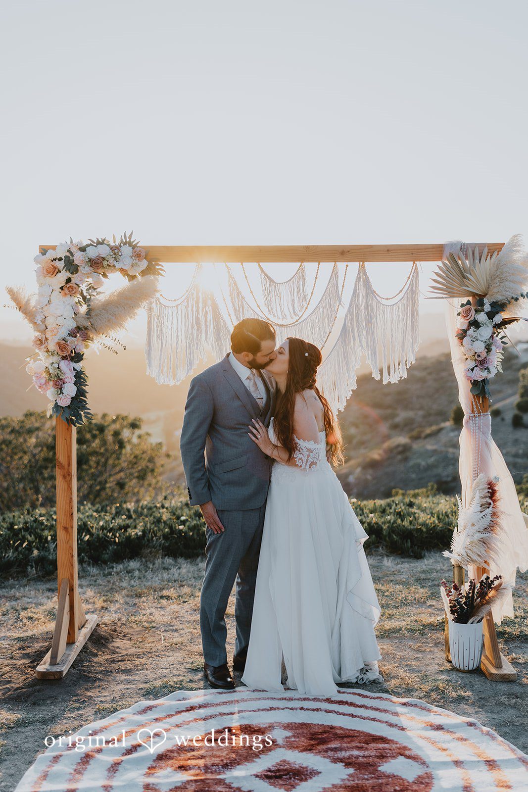 Romantic kiss moment of couple captured by San Diego Wedding Photographers