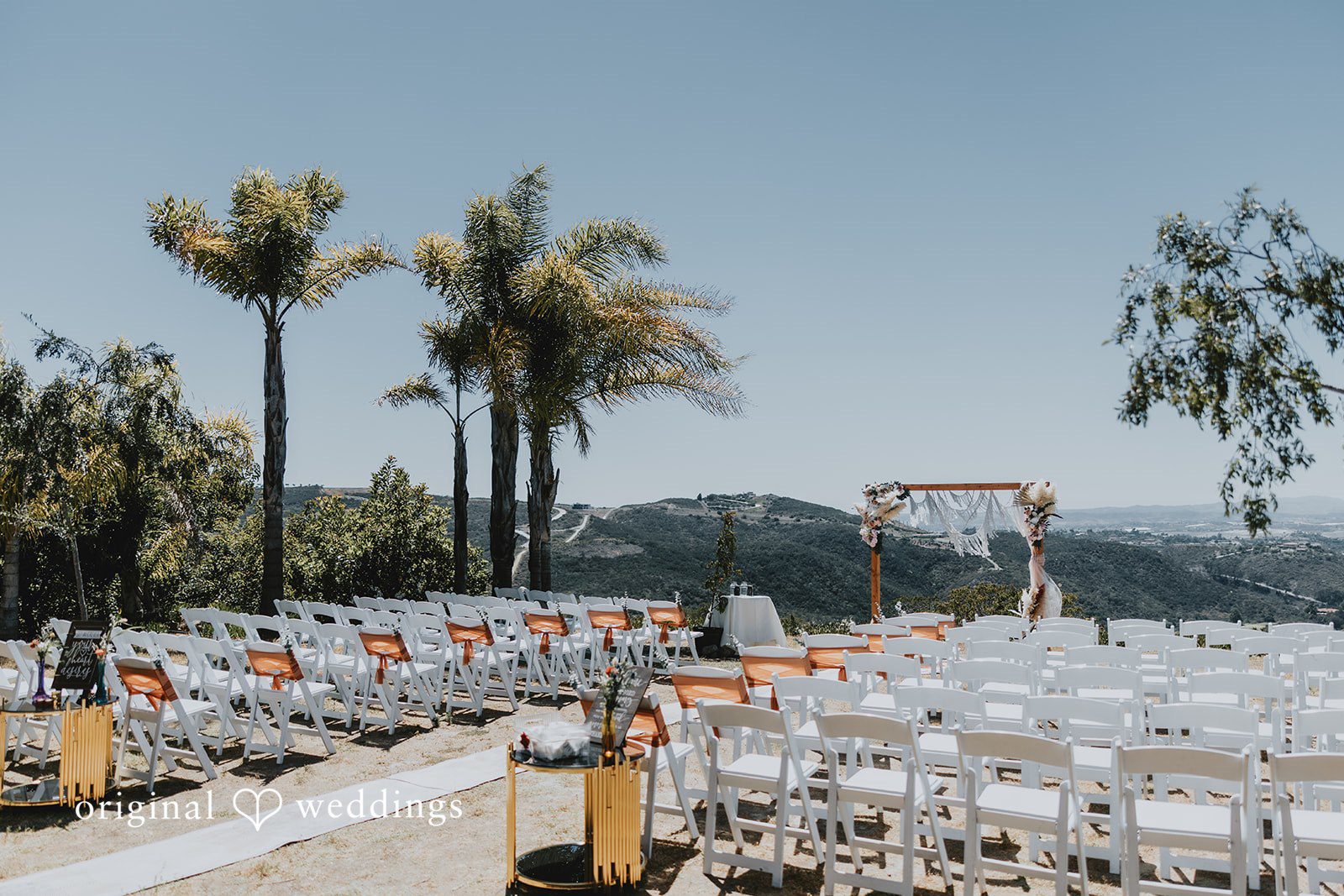 Scenic outdoor view of altar decorated for wedding ceremony