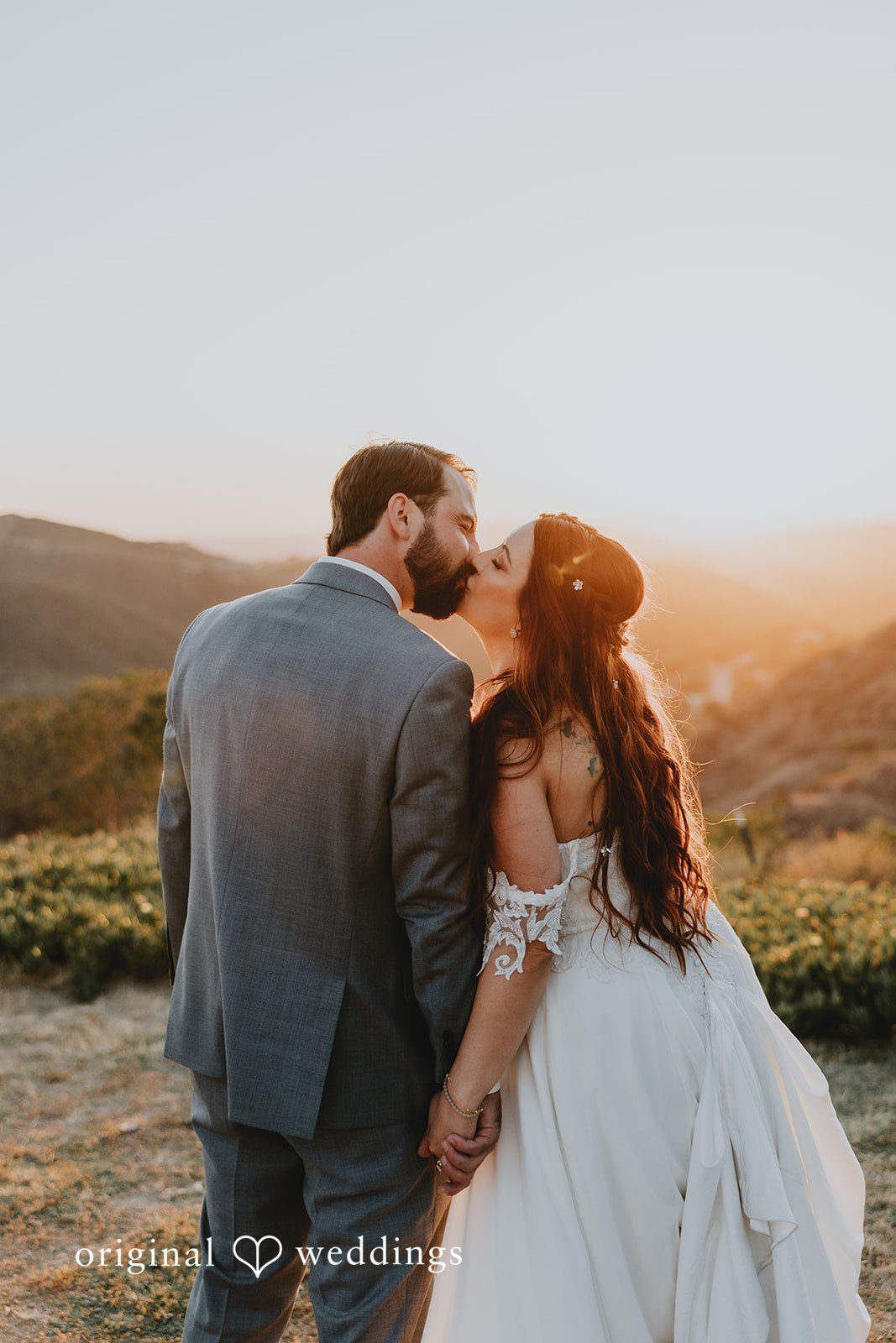 Bride and groom sharing a kiss in a quite moment