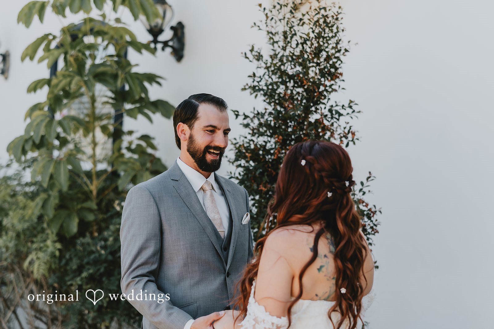 Groom looking at the bride with happiness
