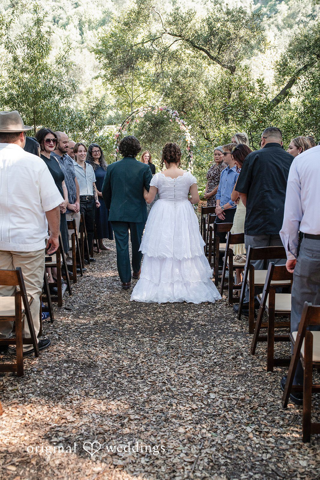 Keely + Sam Bride and groom walking down the aisle
